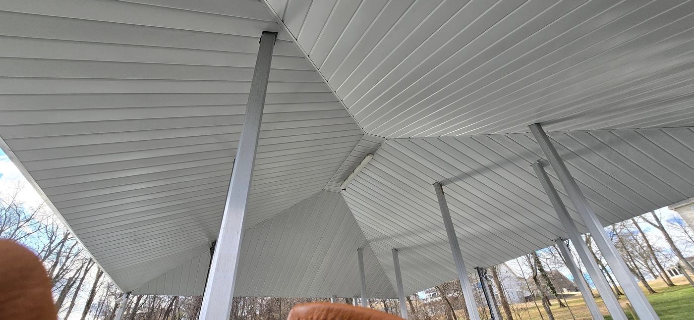 Underside view of hip roof framing over dock, daytime